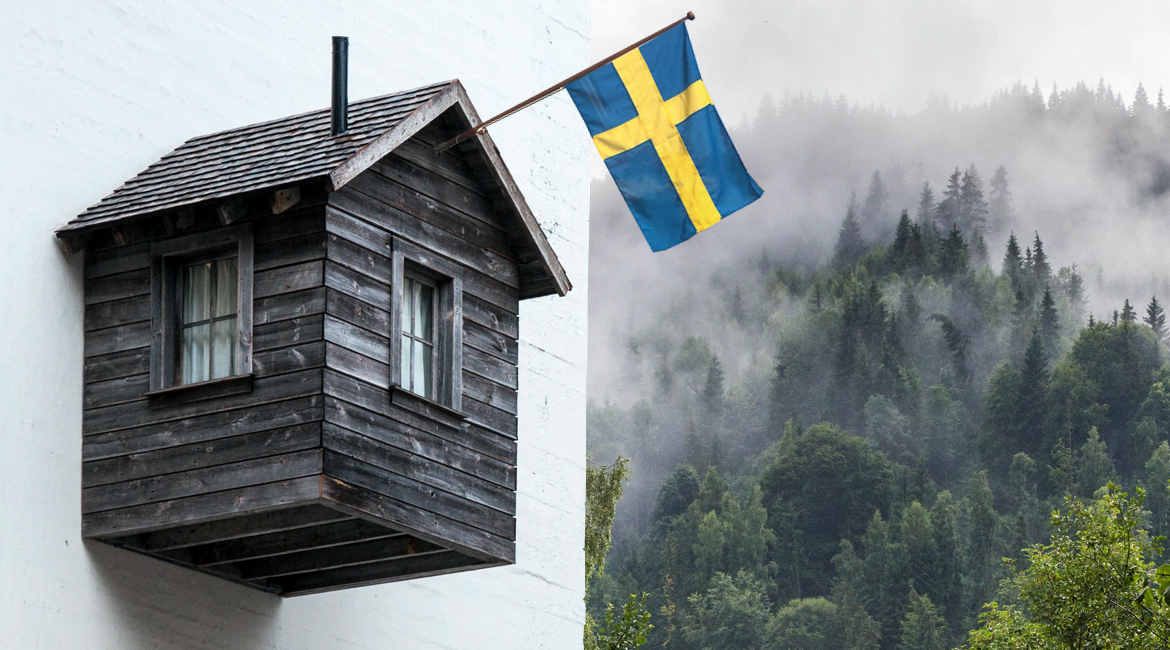 Fågelhols liknande hus på en fasad som har en vimpelflagga. Svenska flaggan. 